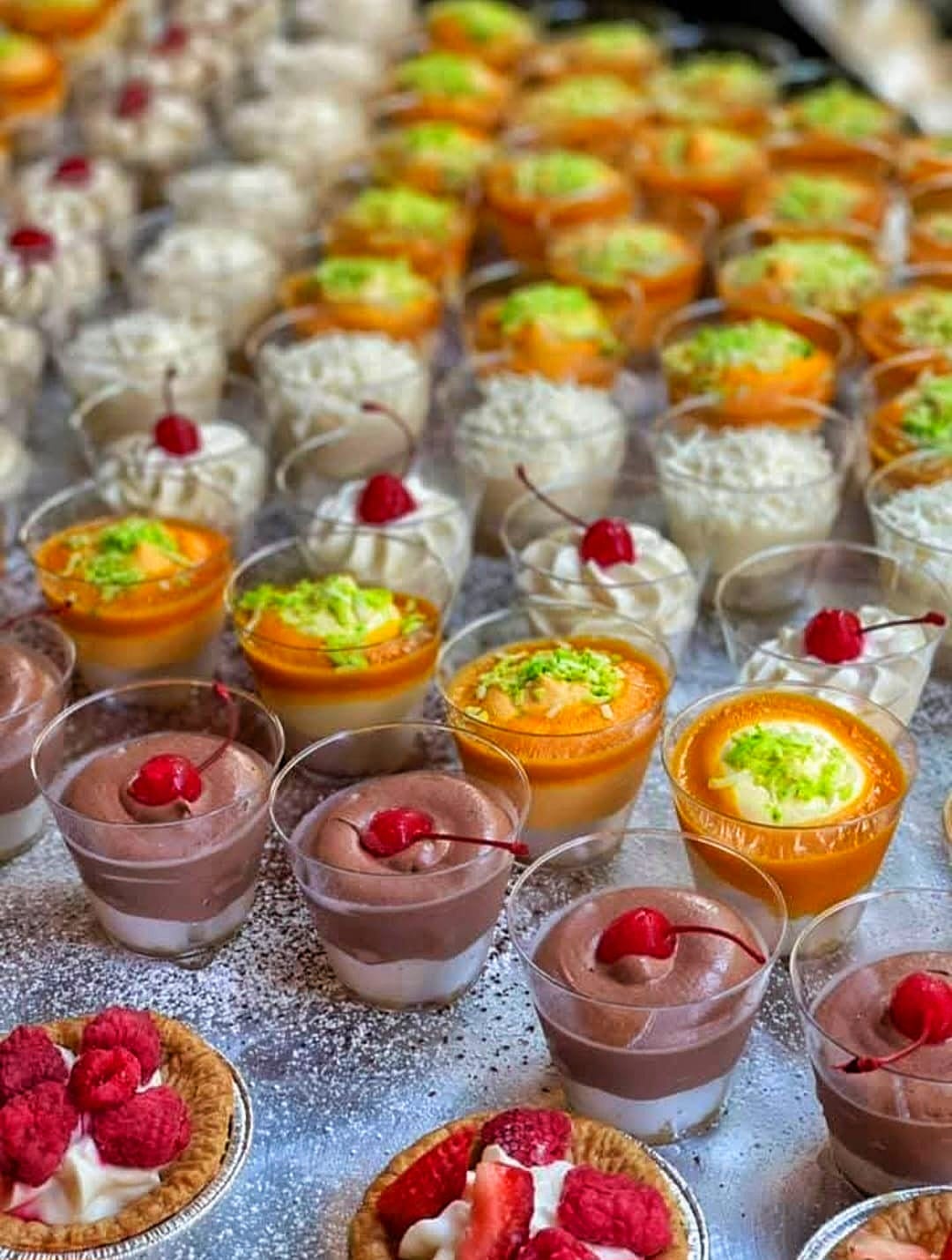 Beautifully arranged dessert table with various cakes and pastries by 5 Star Bakers